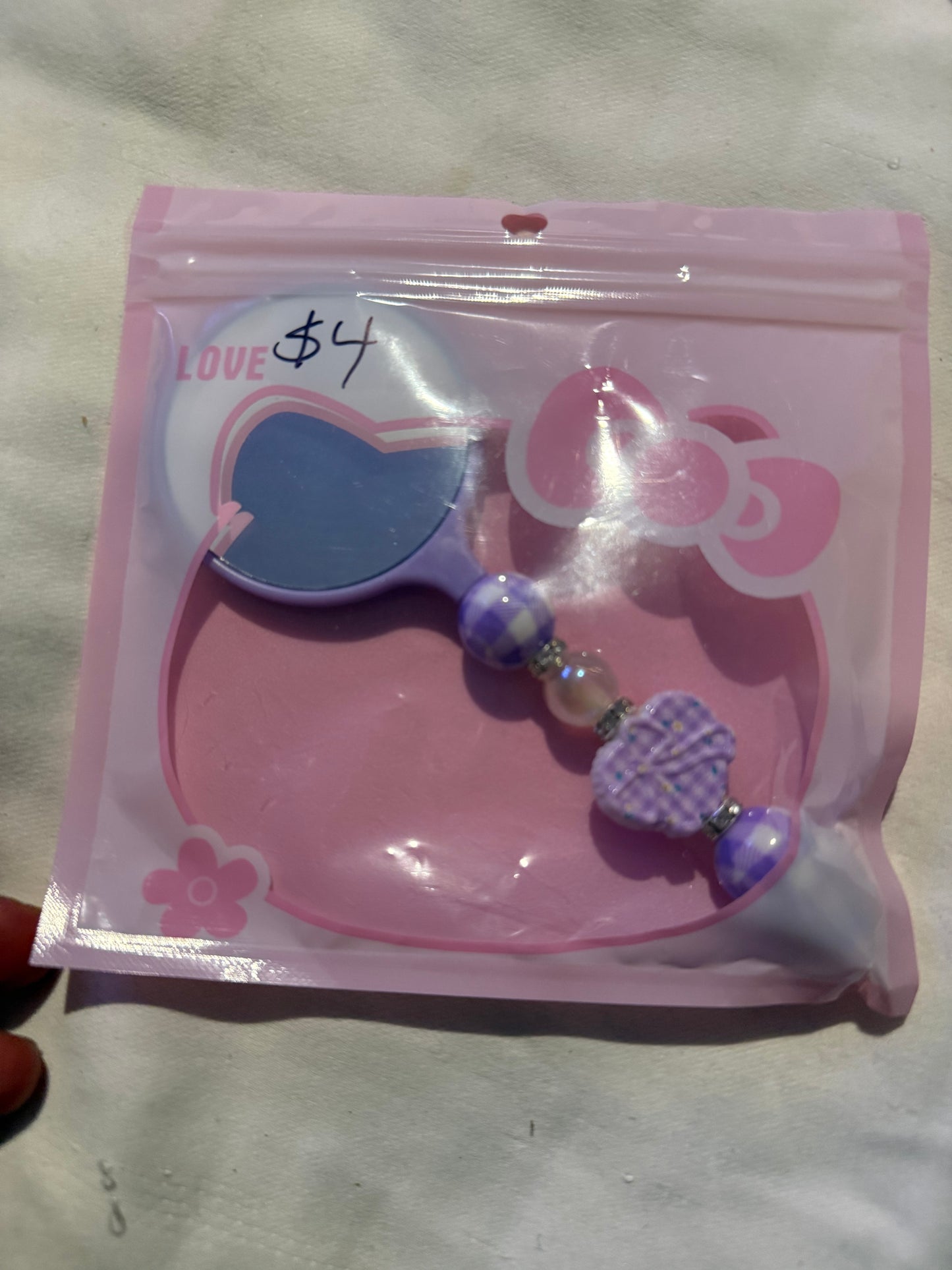 Small hand beaded mirrors