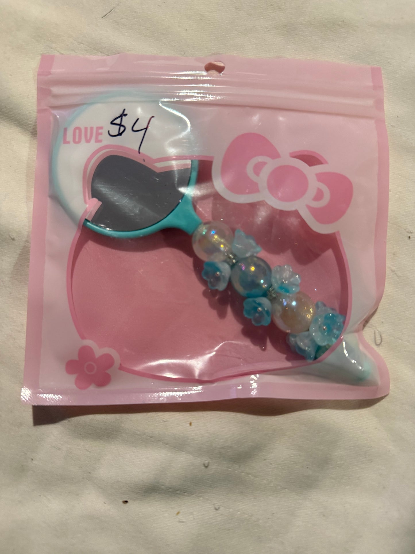 Small hand beaded mirrors