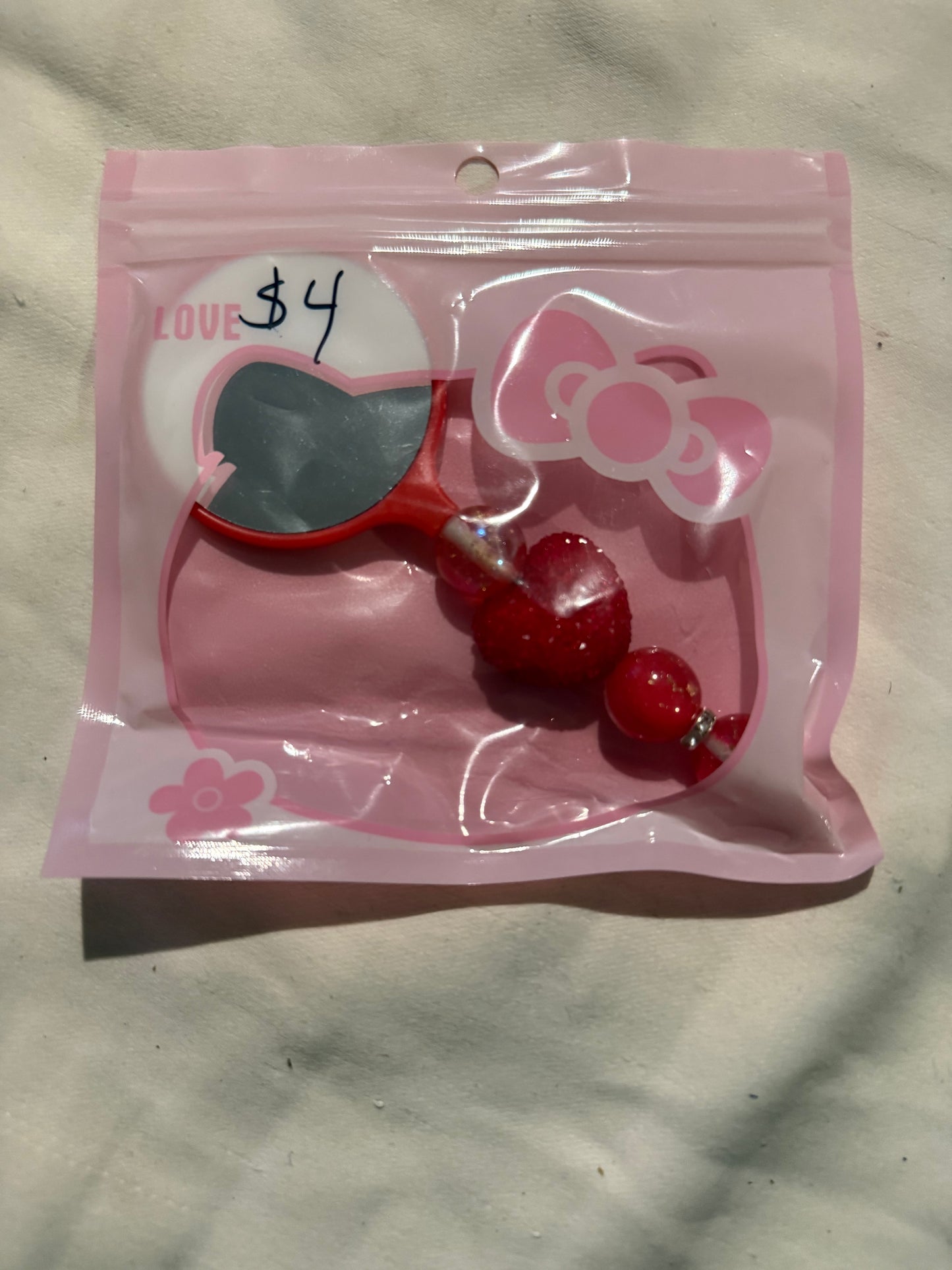 Small hand beaded mirrors