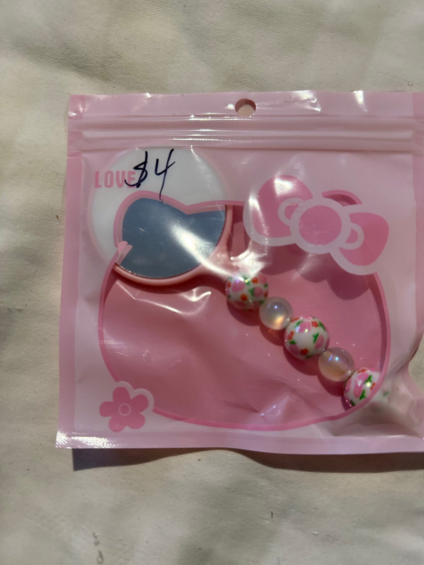 Small hand beaded mirrors