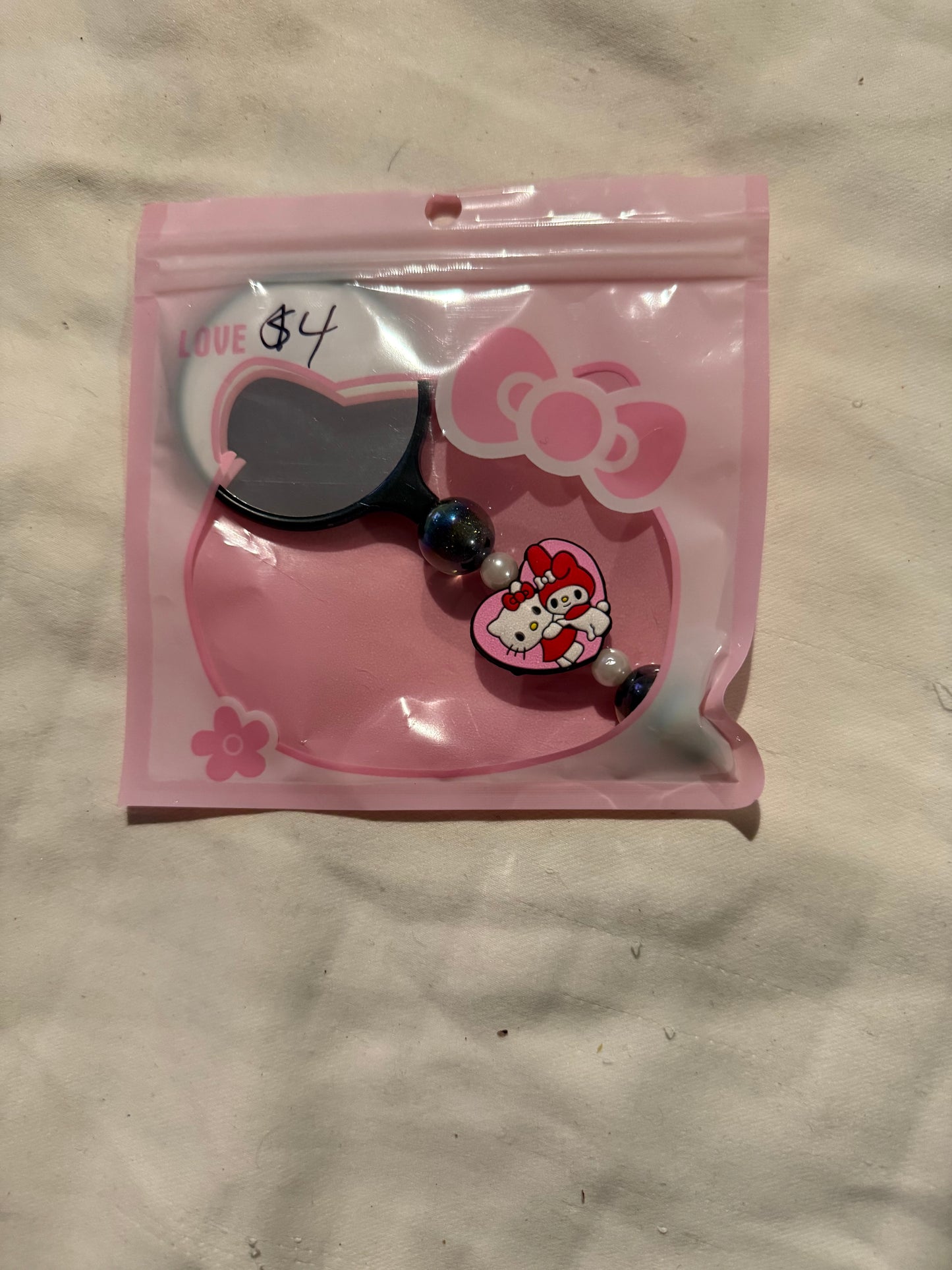 Small hand beaded mirrors