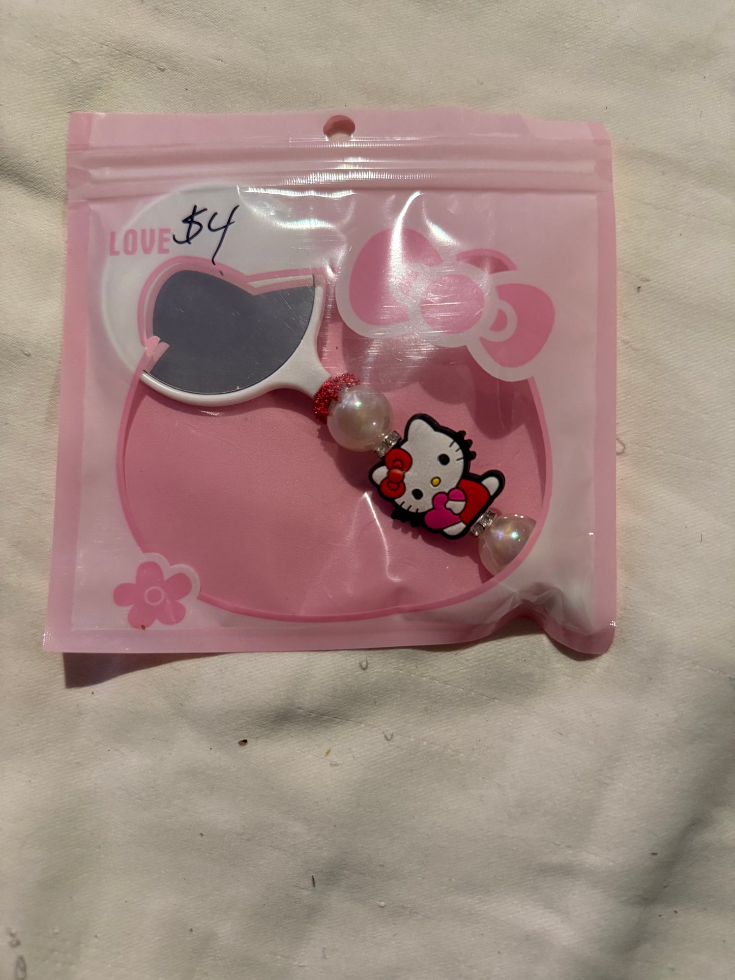 Small hand beaded mirrors