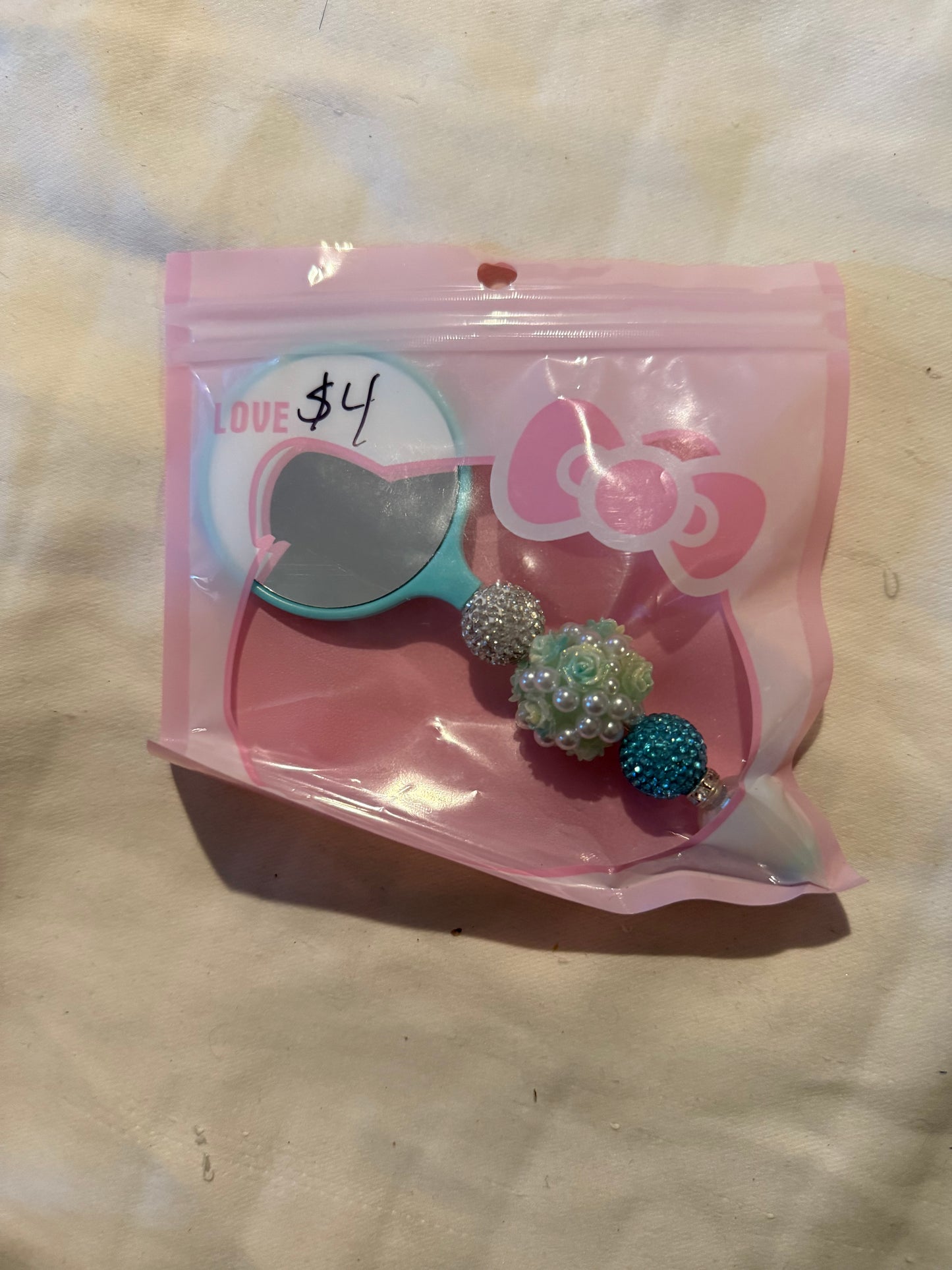 Small hand beaded mirrors