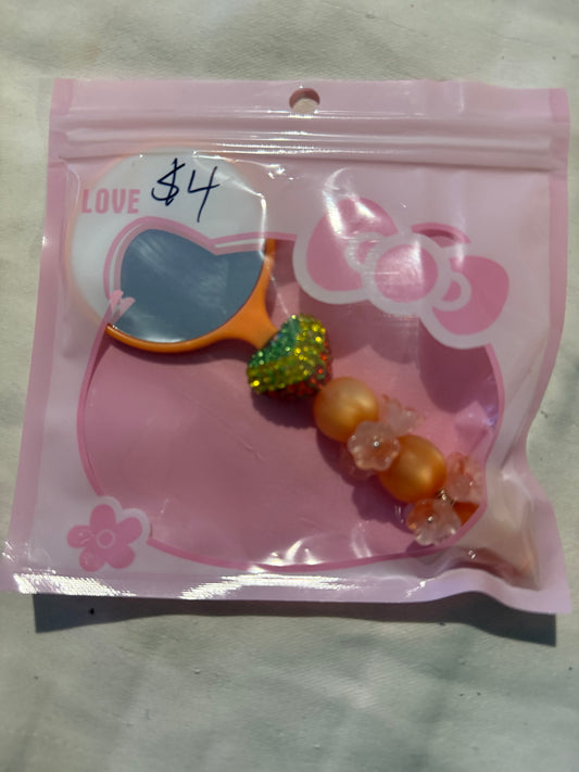 Small hand beaded mirrors